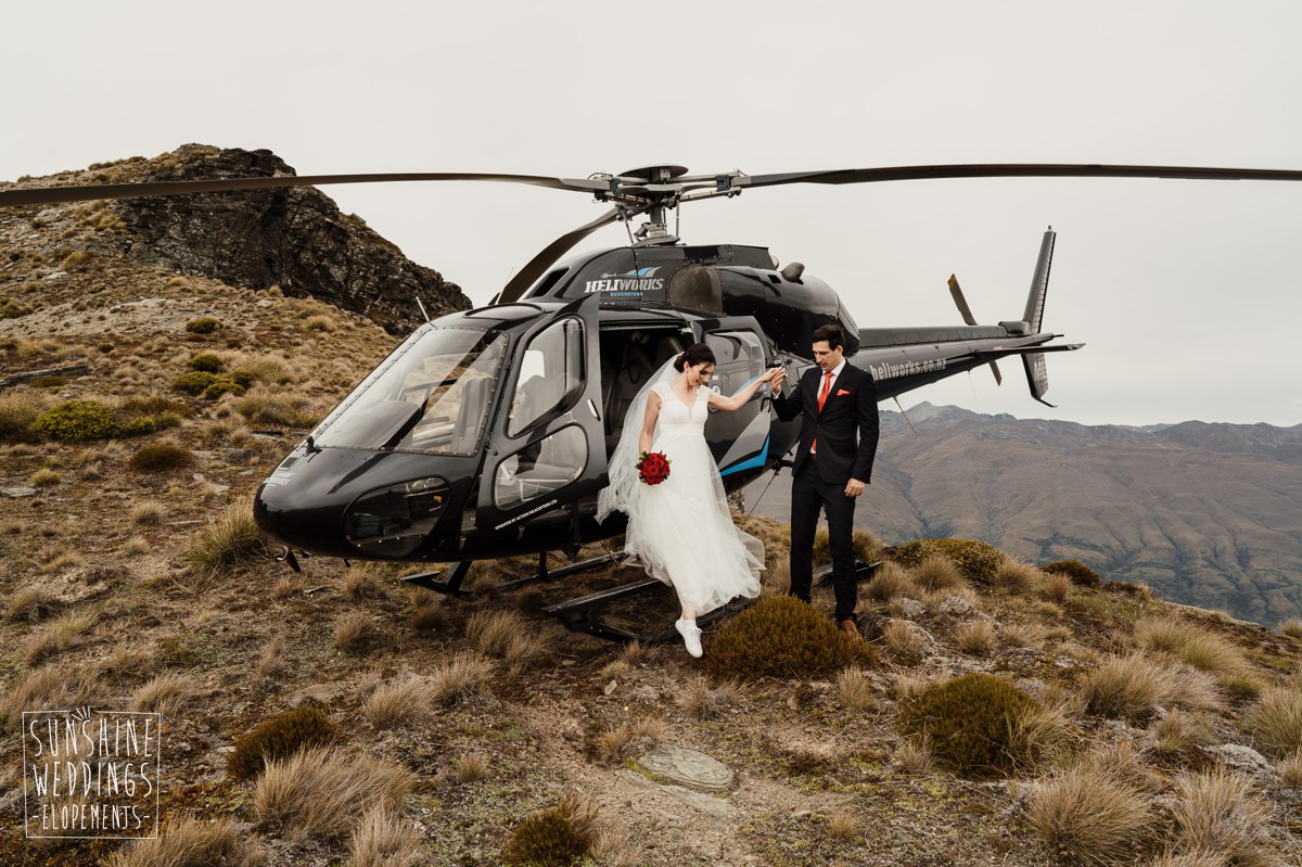 getting out of helicopter on a mountain